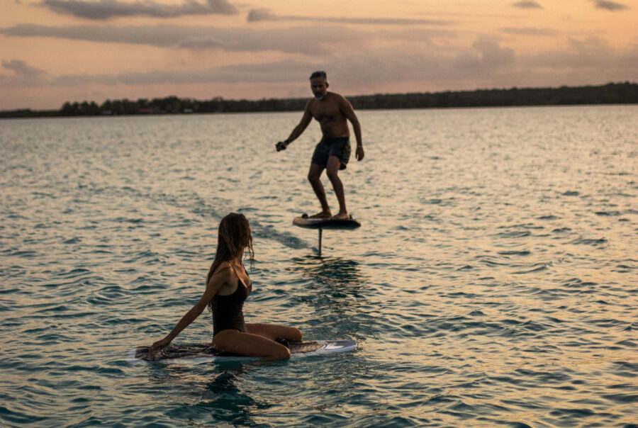 couple enjoy WAKESURFING